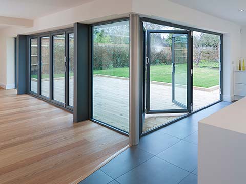 Why Bi-Folding Doors Are A Great Addition For The Summer